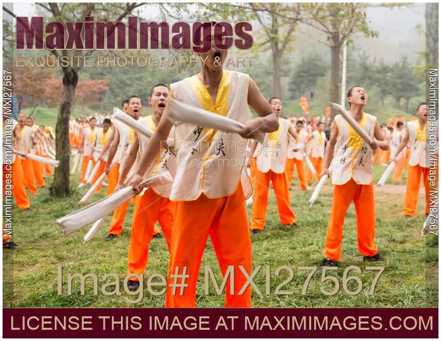 Students of Shaolin martial arts school conditioning their body