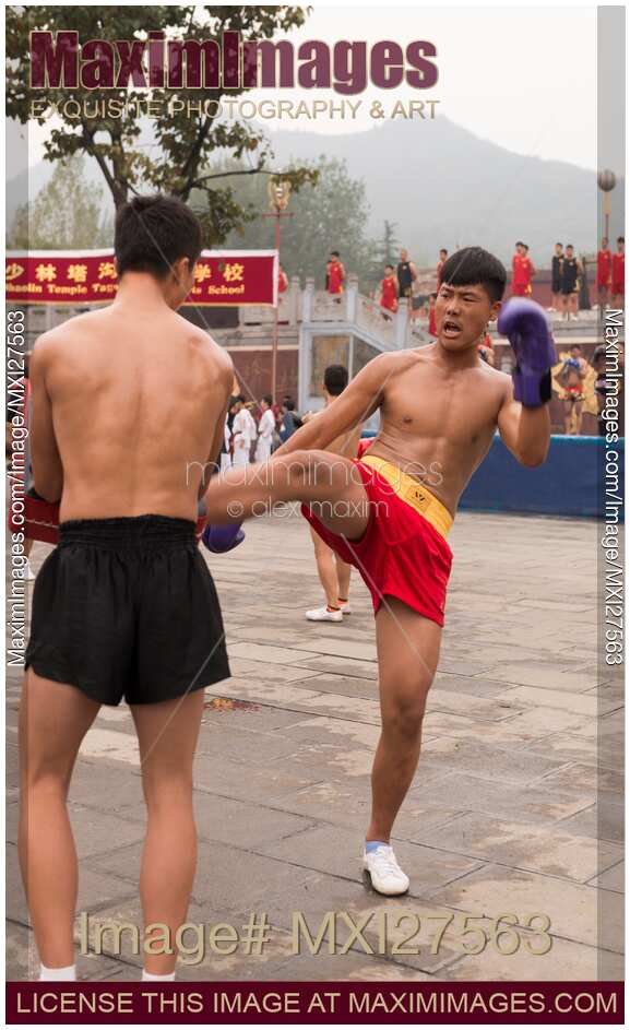 Students of Shaolin martial arts school practicing Sanda