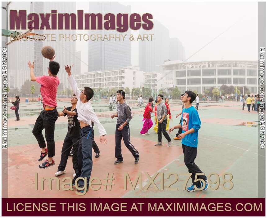 Students playing basketball in China