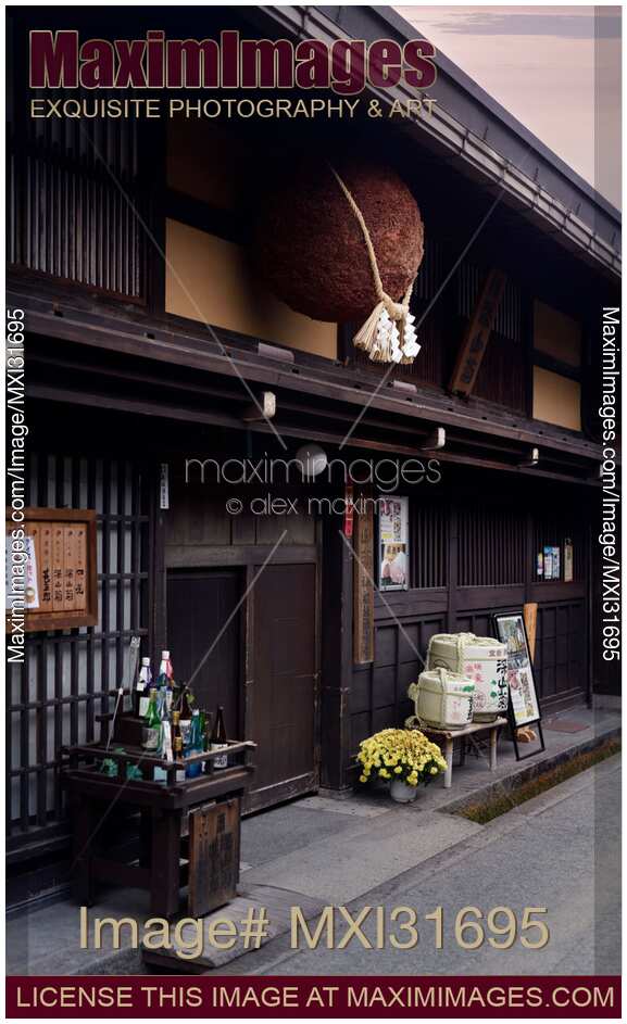 Sugidama cedar ball with Shinto rope hanging above the entrance of a sake brewery in Takayama Gifu Japan