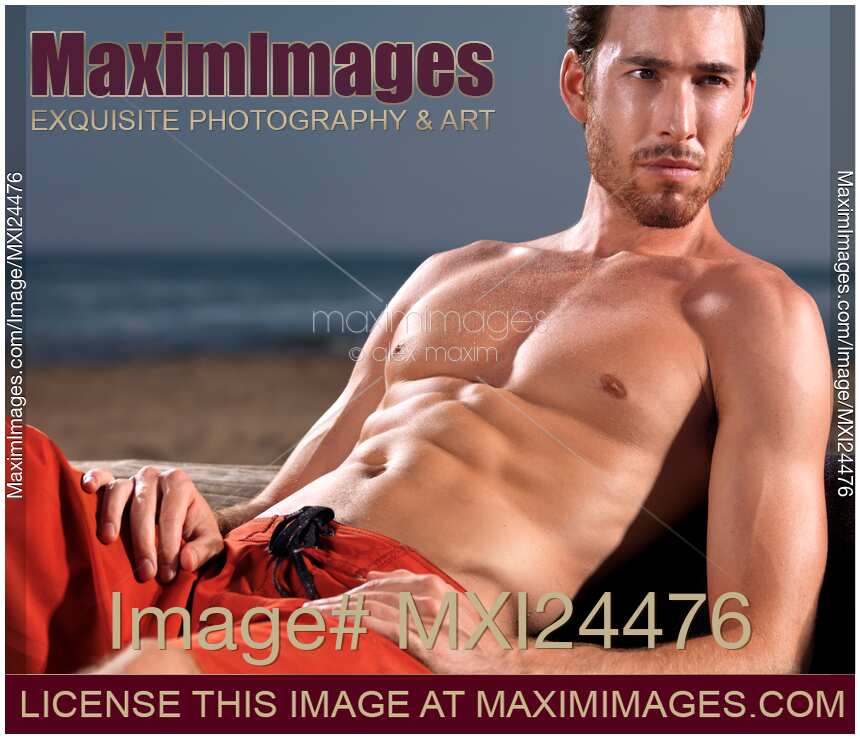 Suntanned young man at the beach