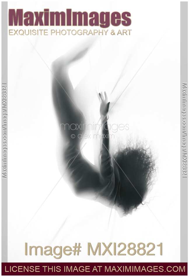 Surreal woman silhouette falling into white misty dream