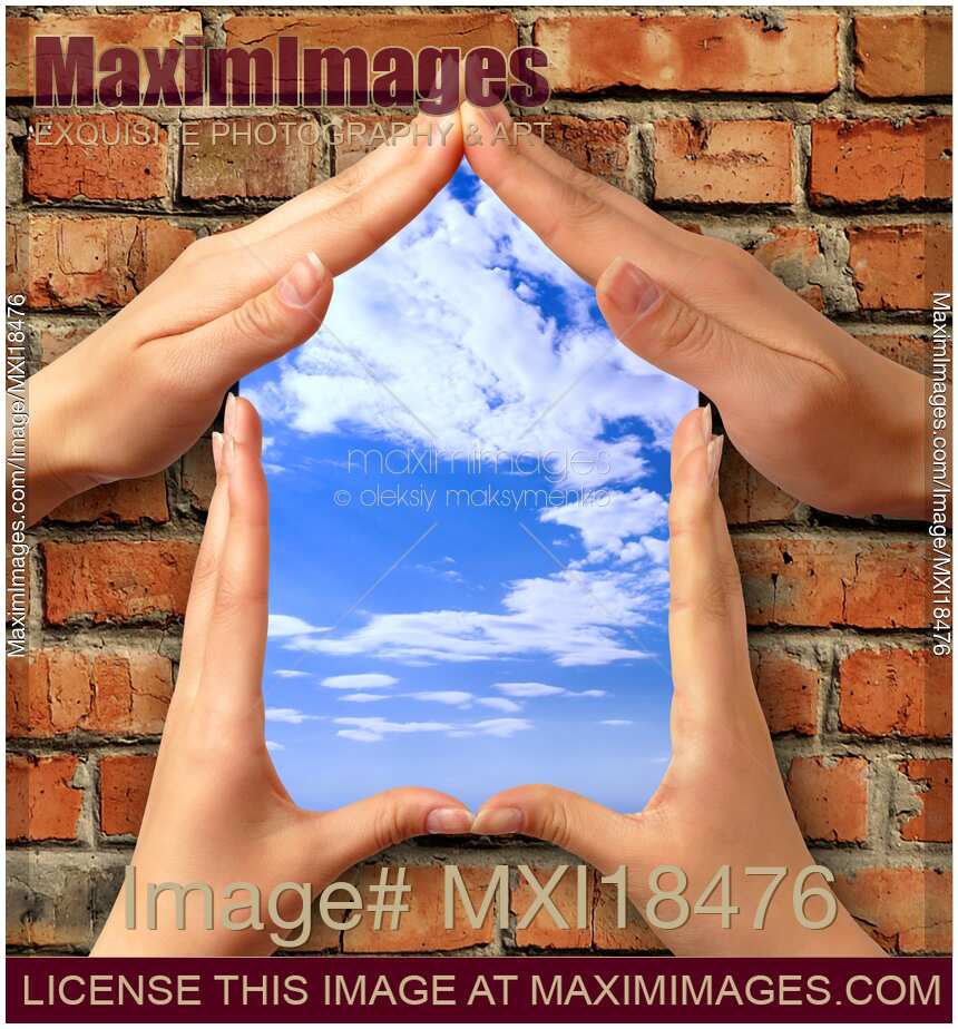 Symbol home over brick wall