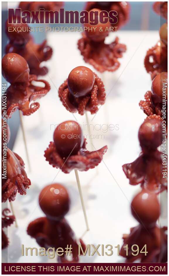 Takotamago Tako tamago grilled stuffed octopus on skewer at food market in Japan
