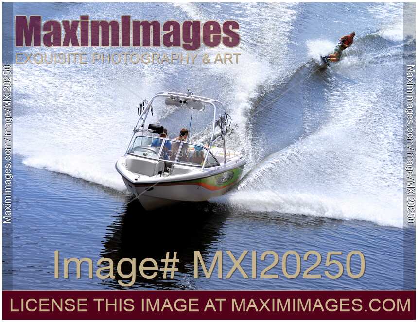 Teenage Girl Wakeboarder Behind a Motorboat
