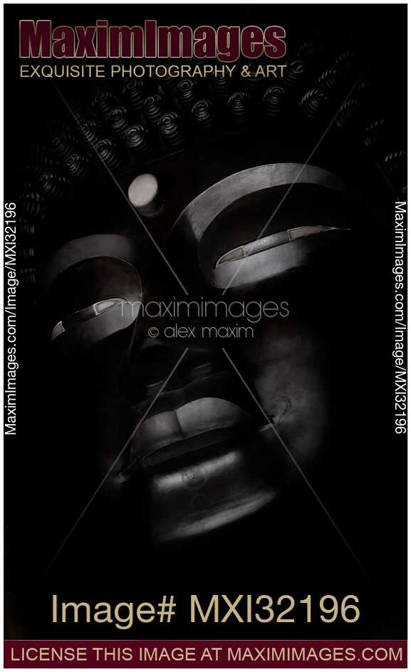 The Great Buddha statue face on black background
