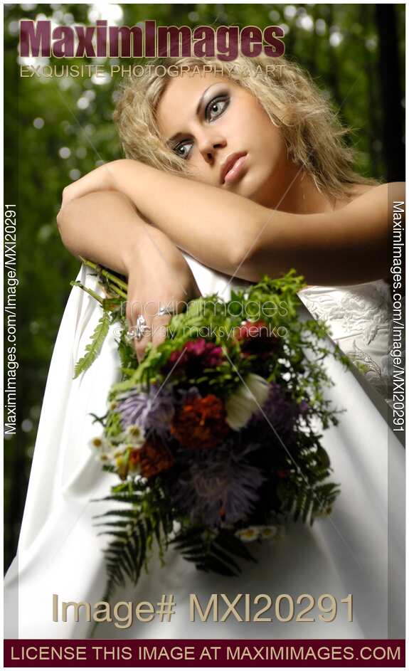 Thoughtful Lonely Young Bride in Wedding Dress