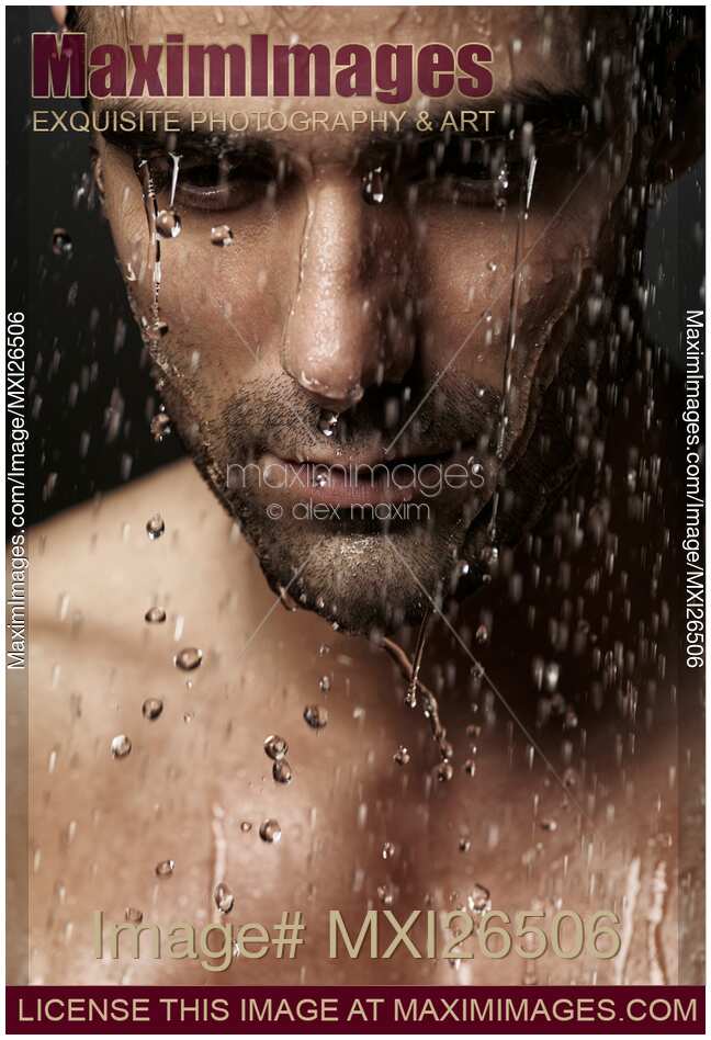 Thoughtful man face under pouring water