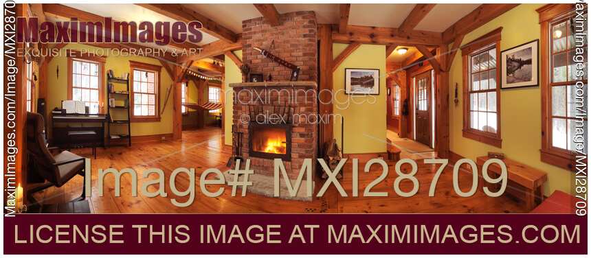Timber frame Canadian house interior living room with fireplace