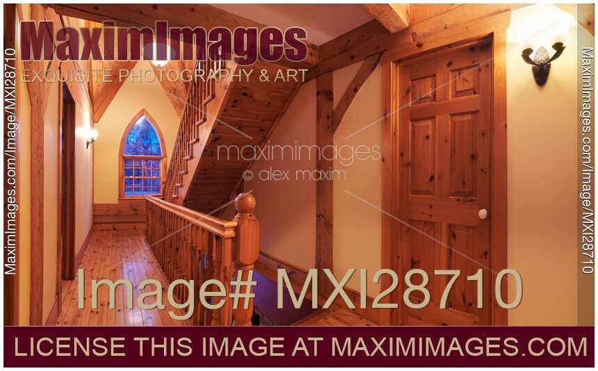 Timber frame cottage style Canadian house hall with wooden staircase