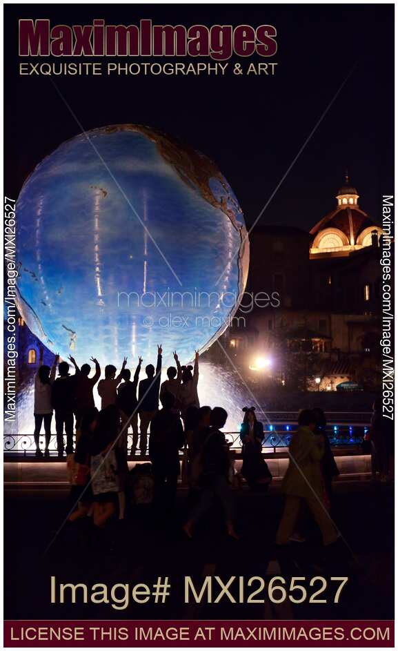 Tokyo Disneysea theme park Earth globe fountain at night