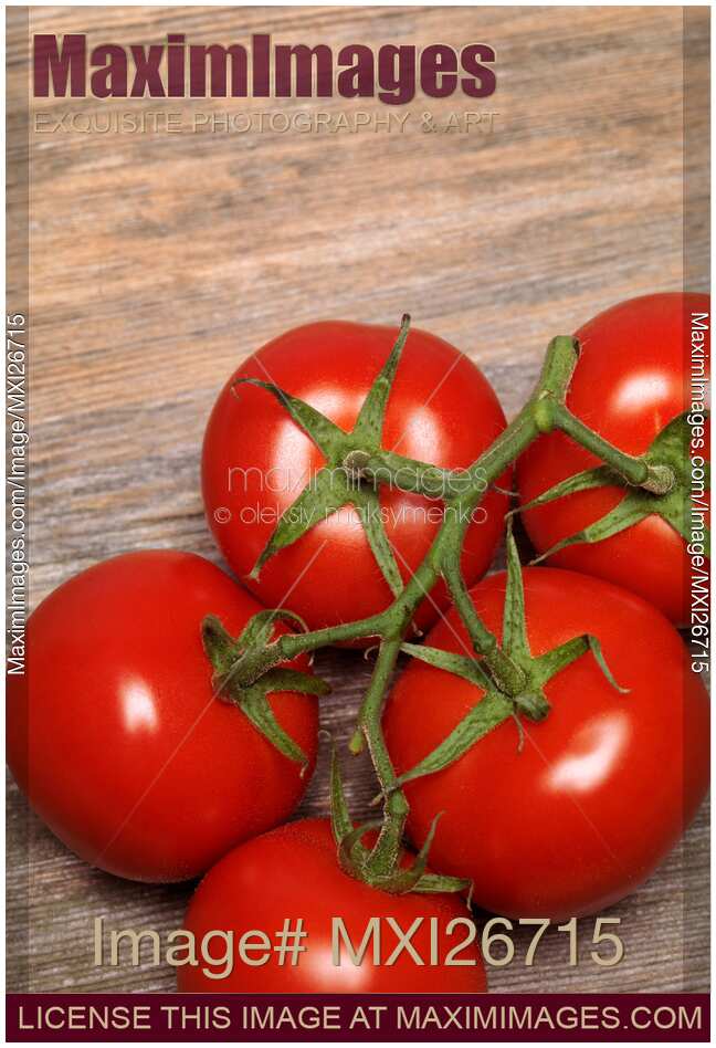 Tomatoes on wooden background