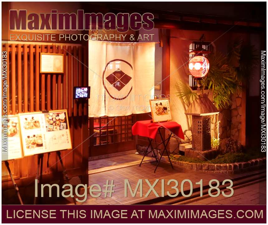 Traditional Japanese restaurant in Gion Kyoto at night with menus and Noren curtain in the entrance