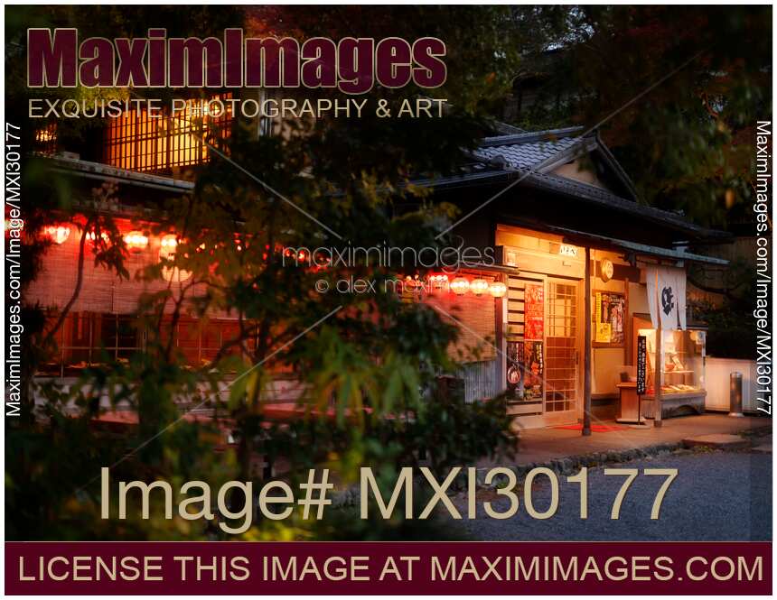 Traditional Japanese restaurant with lit lanterns in Kyoto Japan
