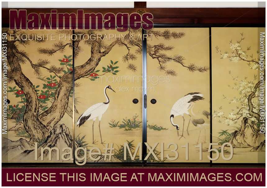 Traditional Japanese temple room interior with cranes painted on golden sliding doors