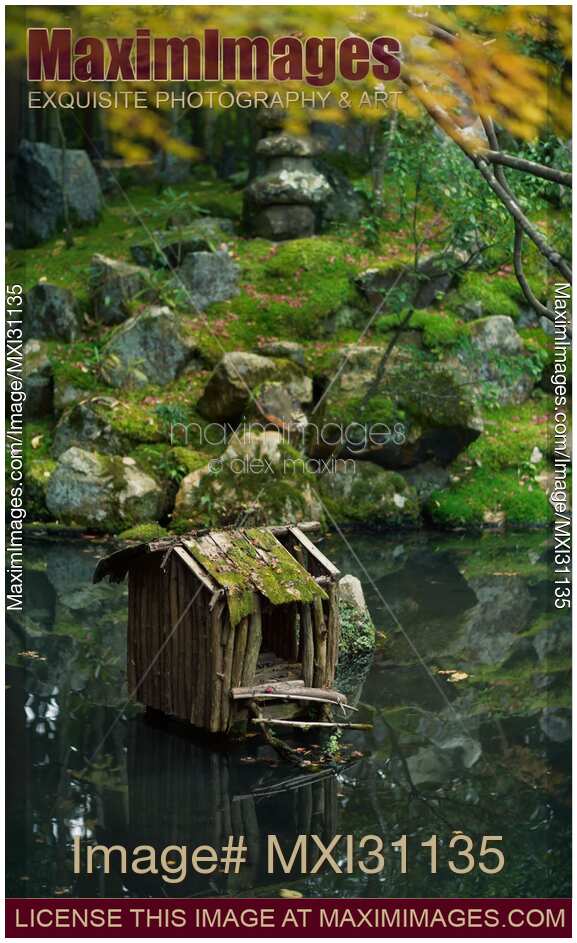 Tranquil scenery of Tenjuan Temple Japanese Zen pond garden moss covered landscape