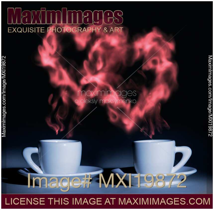 Two hearts of steam over coffee cups