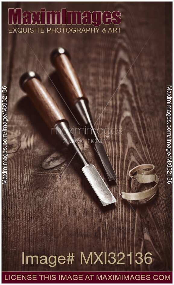 Two Japanese Tataki chisels and wood shavings on a table Carpentry still life