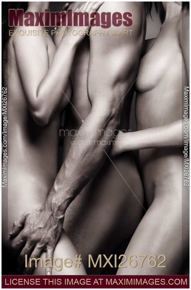 Two nude women with one man. Sexy love threesome art nude closeup.