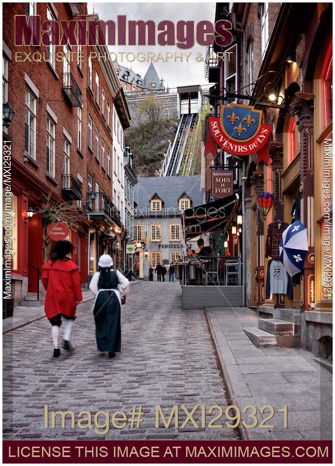 Two persons dressed in medieval costumes walking up the Rue Sous Le Fort street in old Quebec City