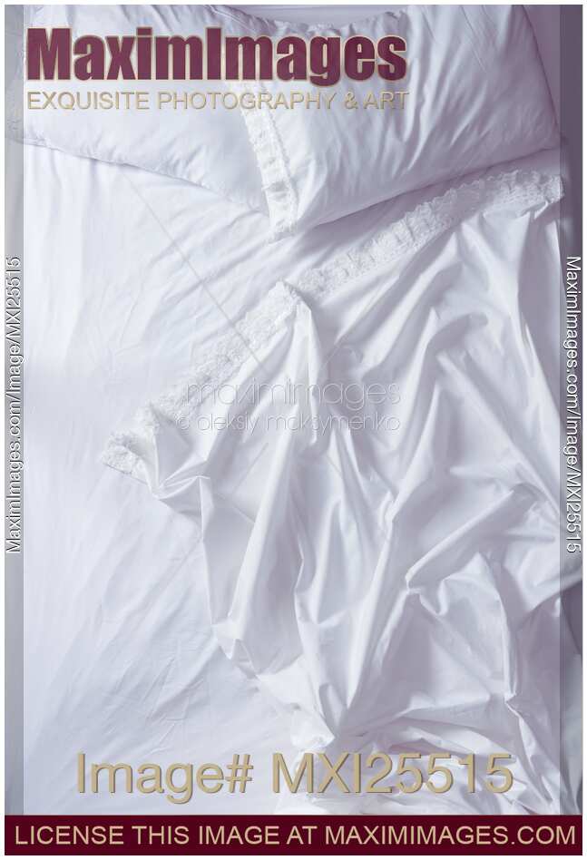 Unmade bed view from above
