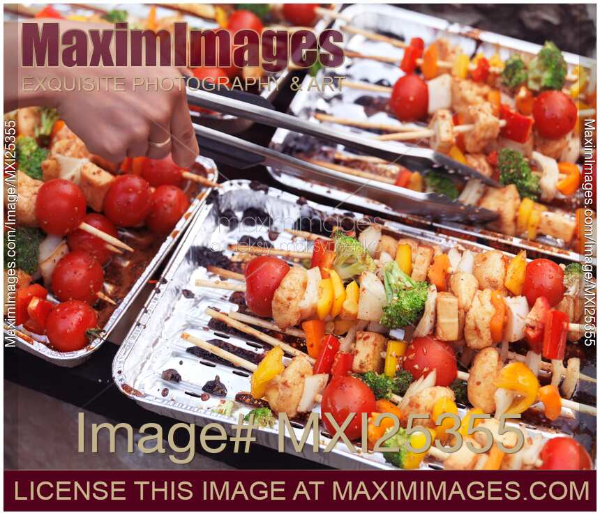 Vegetarian skewers cooking on fire