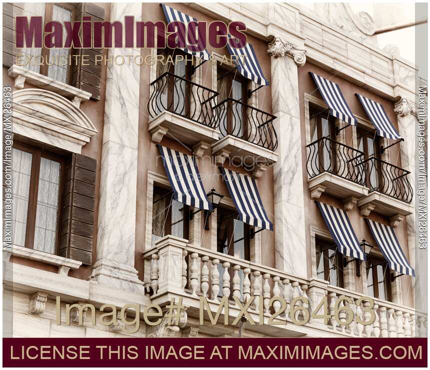 Venetian house windows with canopies