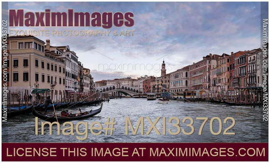 Venice Grand Canal and Rialto Bridge with boats and gondolas with beautiful historic Venetian architecture panorama