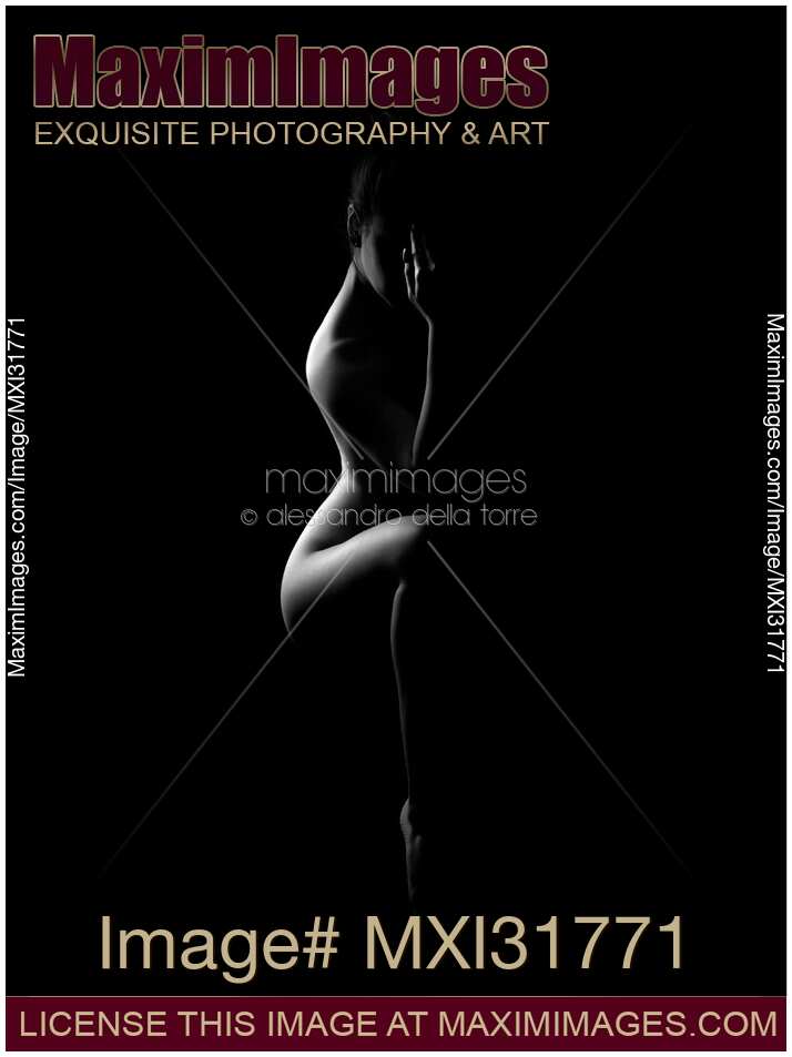 Vertical abstract nude woman body outline on black background black and whitea