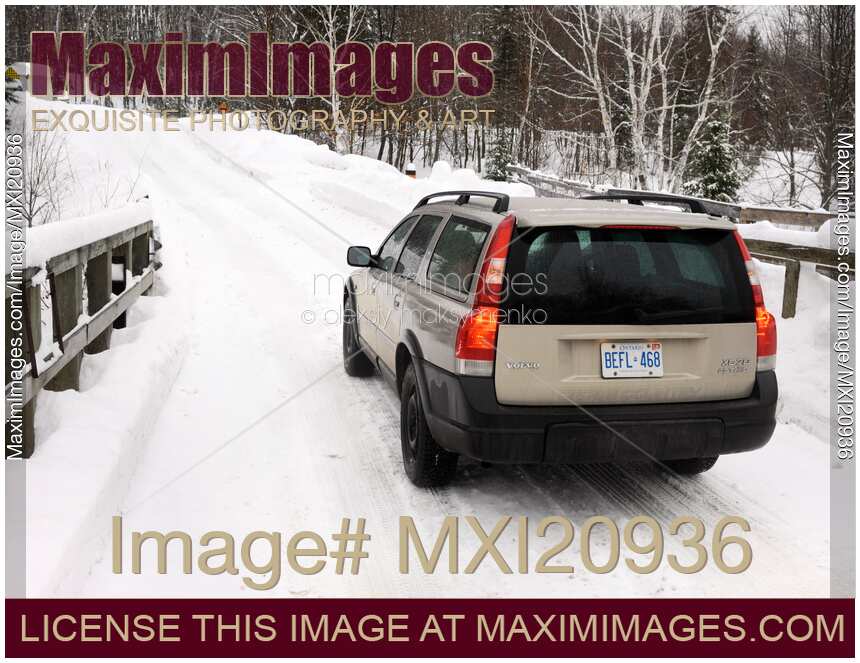Volvo XC70 station wagon Winter travel on a snow covered road
