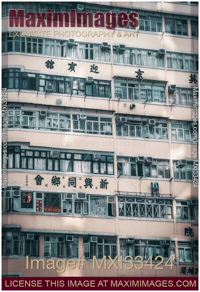 Wall of an urban residential high-rise building with balconies in Hong Kong China