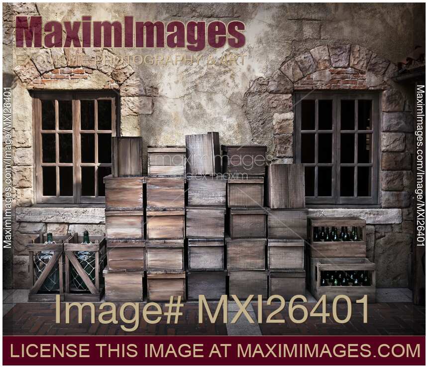 Wine bottles and crates outside of old house