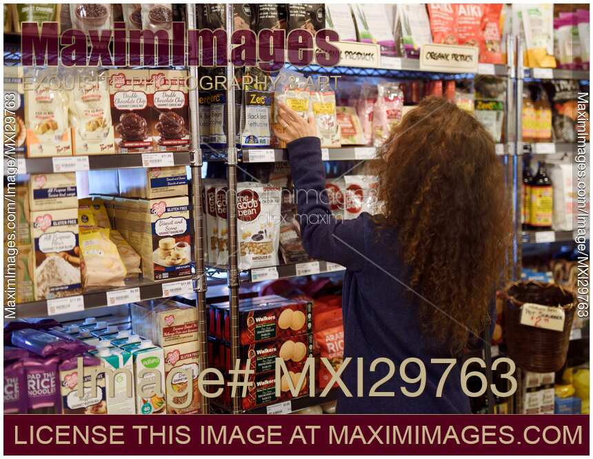 Woman at a grocery store in organic products section