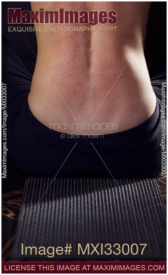 Woman back with nail prints from acupressure needle mat