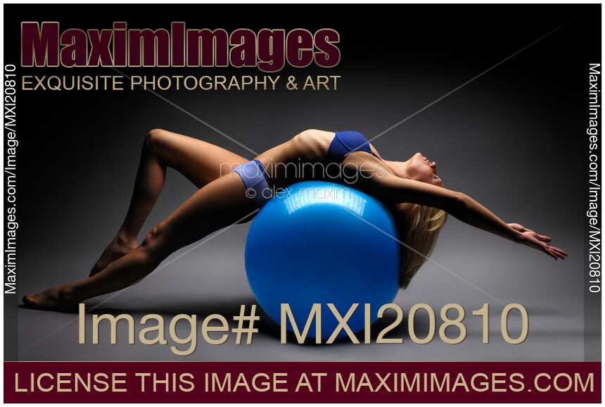 Woman Balancing on an Exercise Ball Artistic Fitness Concept