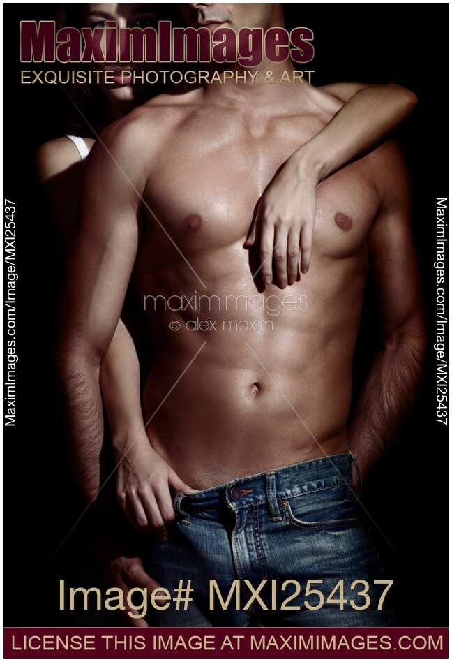 Woman behind sexy man with bare torso and jeans