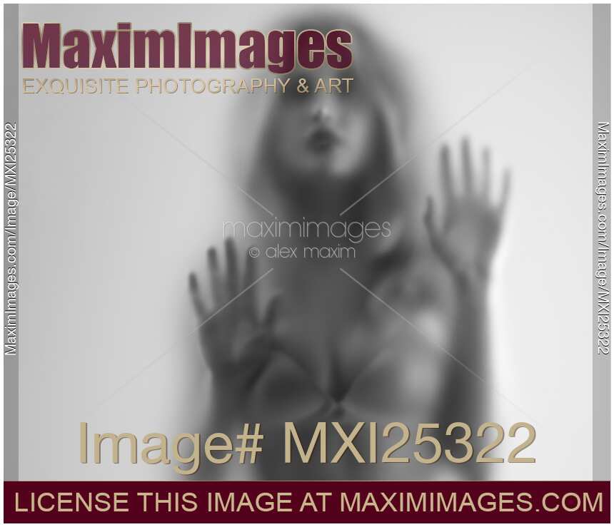 Woman blurred silhouette behind hazy glass