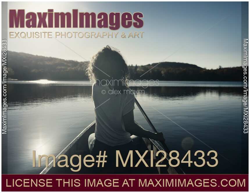 Woman canoeing on a lake