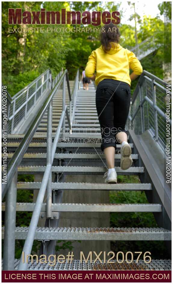Woman Climbing up the Stairs