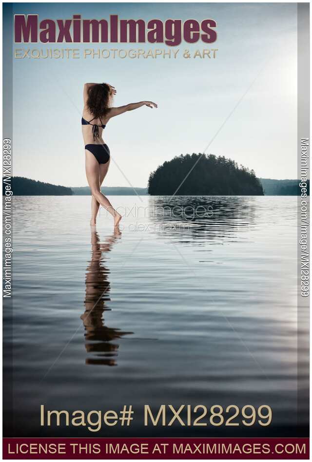 Woman dancing in morning sunlight in the nature