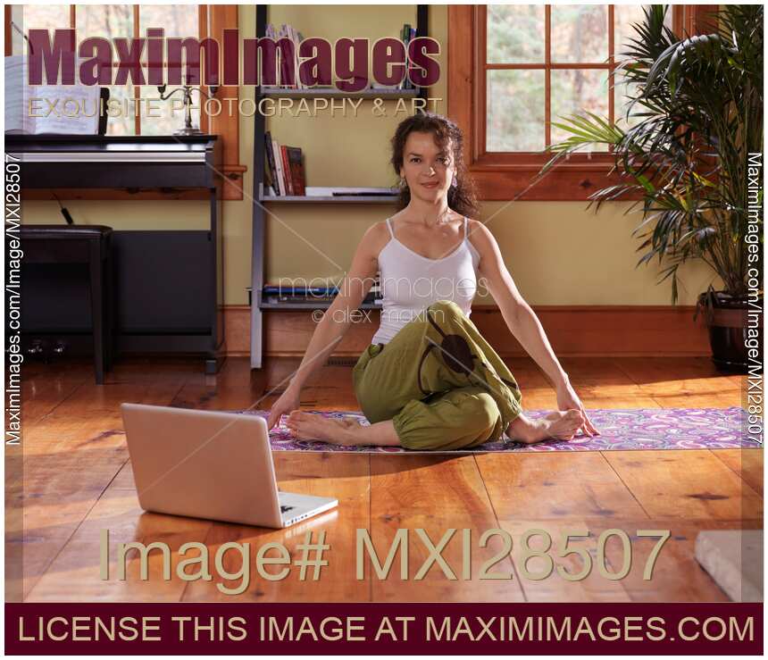 Woman doing yoga at home in living room
