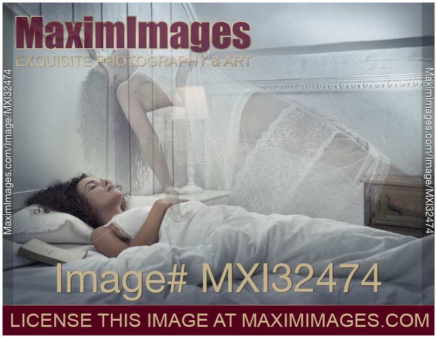 Woman ethereal body levitating above the bed while she is sleeping mystical lucid dreaming concept