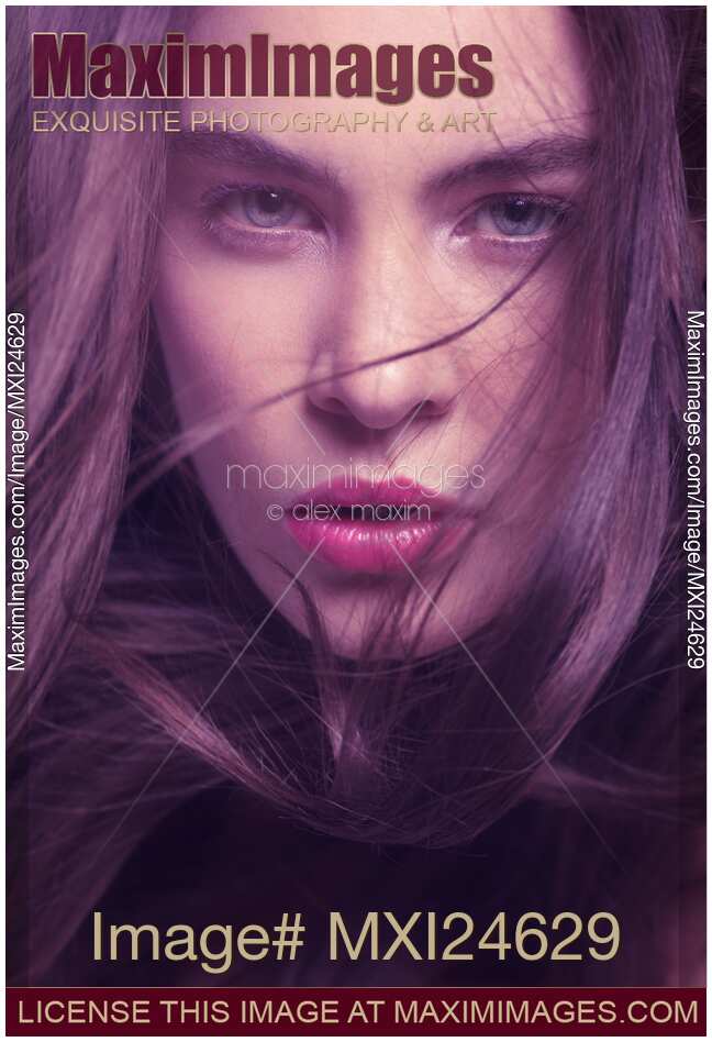 Woman face with flying hair beauty portrait