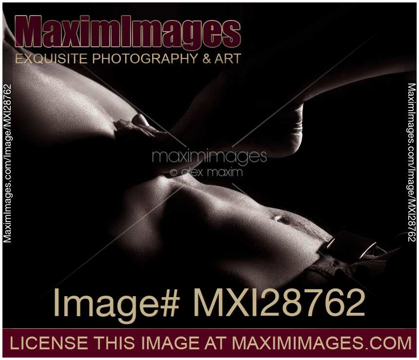 Woman foot on bare man chest sensual body parts closeup