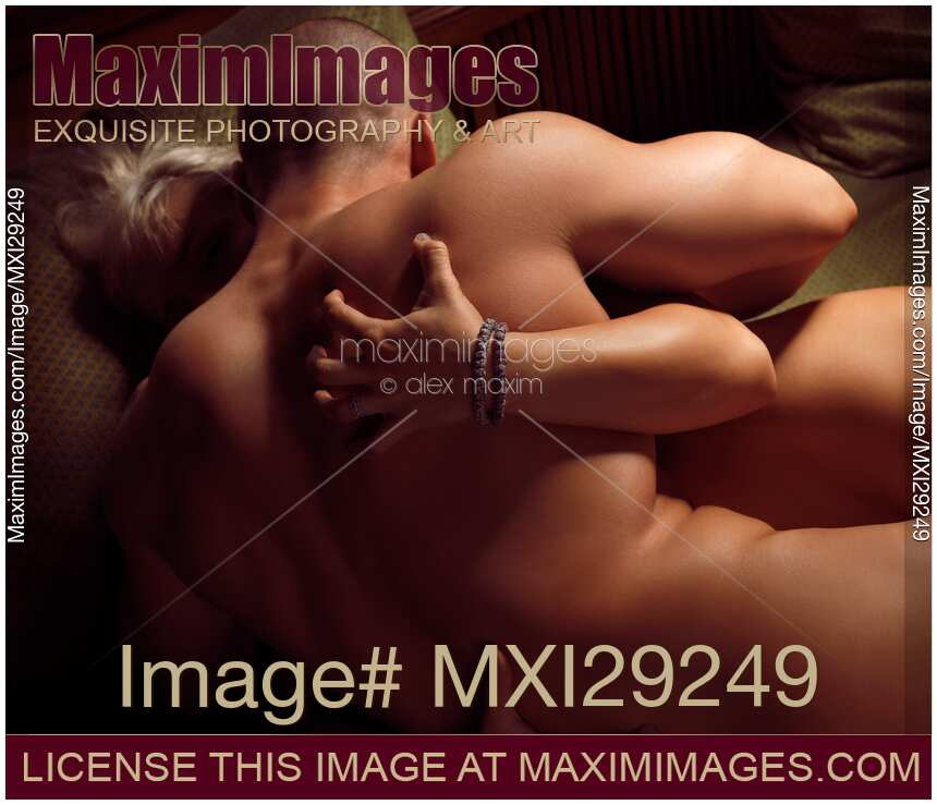Woman Grasping Muscular Man's Back