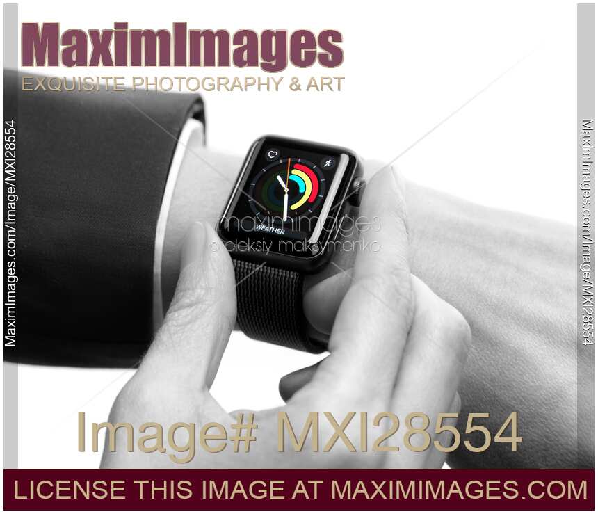 Woman hand with Apple Watch showing daily activity