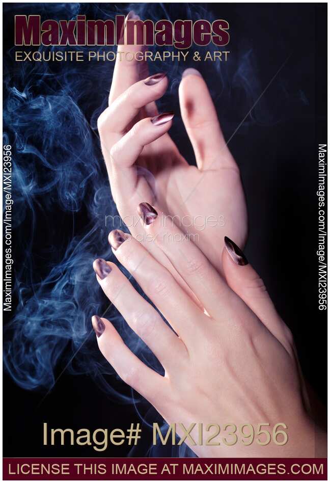 Woman Hands in a Cloud of Smoke
