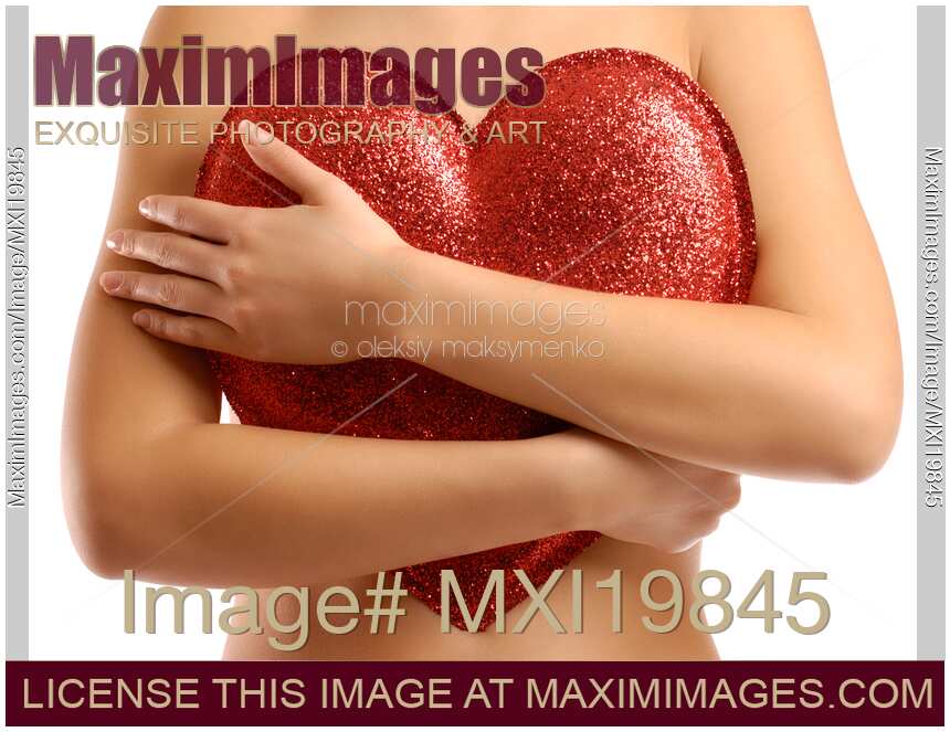 Woman holding red heart to her chest