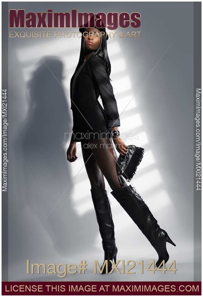 Woman in a Black Jacket and High Boots