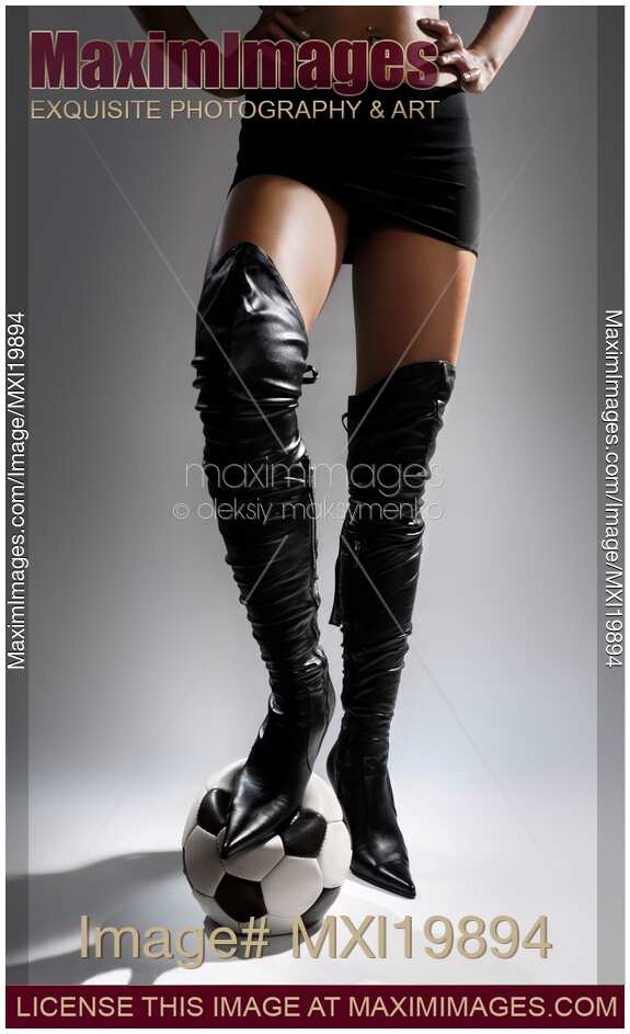 Woman in Leather Boots with a Soccer Ball